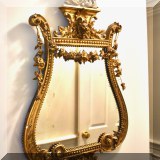 D27. Antique gilt lyre-shaped mirror. 39”h x 23”w 
